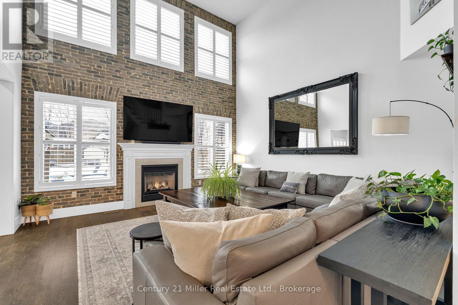 family - 2099 Helmsley Avenue, Oakville (Wm Westmount), ON - Indoor Photo Showing Living Room With Fireplace