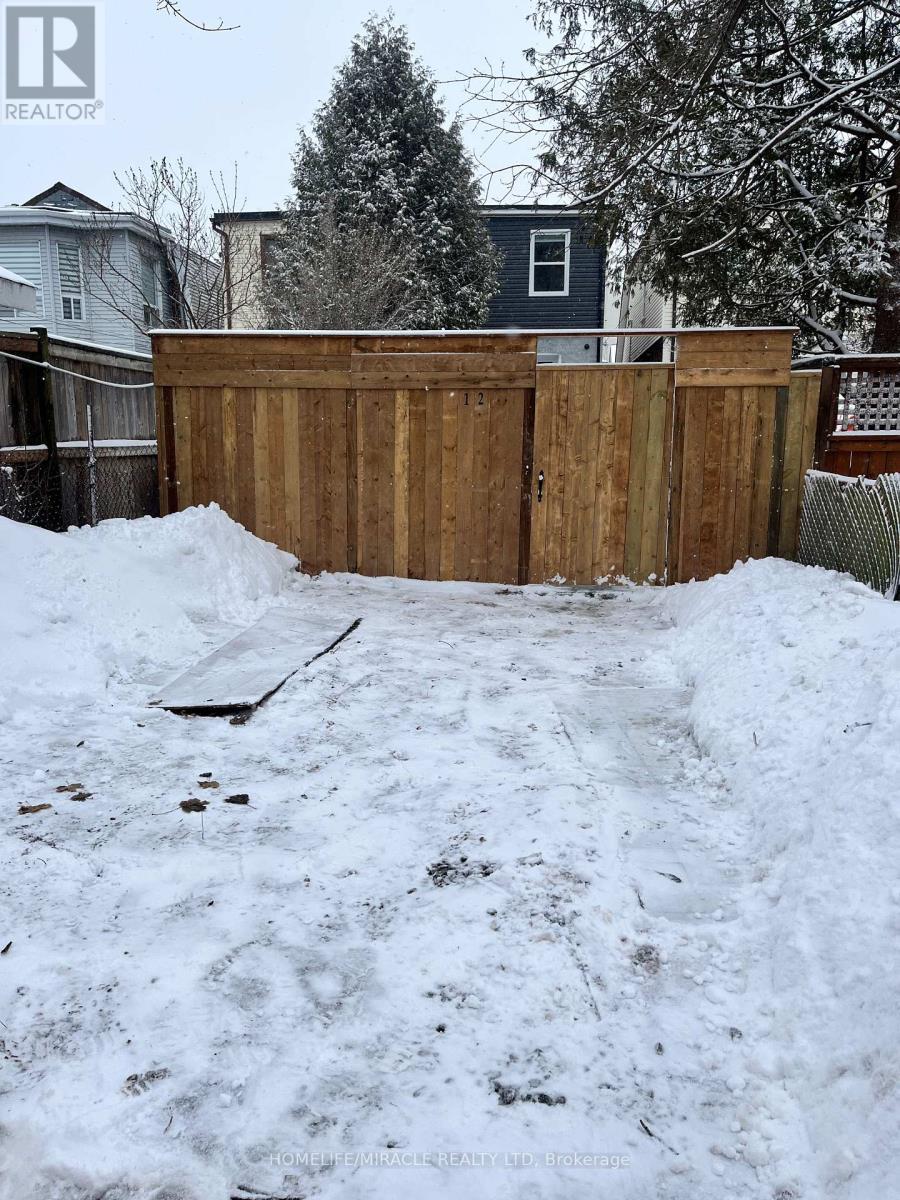 Parking and fenced backyard - 12 Thyra Avenue, Toronto, ON - Outdoor With Deck Patio Veranda