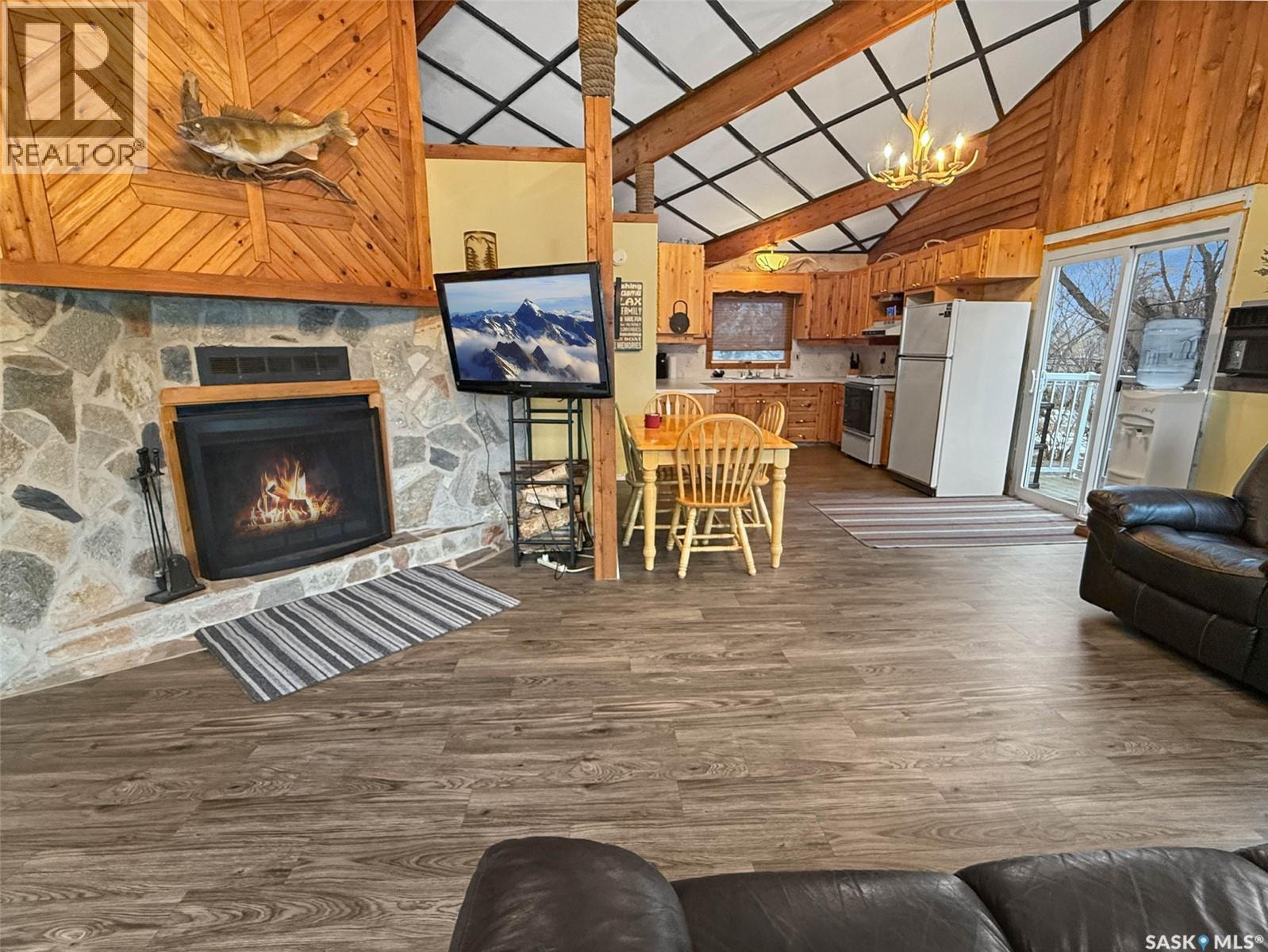 105 Otter Crescent, Beaver Flat, SK - Indoor Photo Showing Living Room With Fireplace