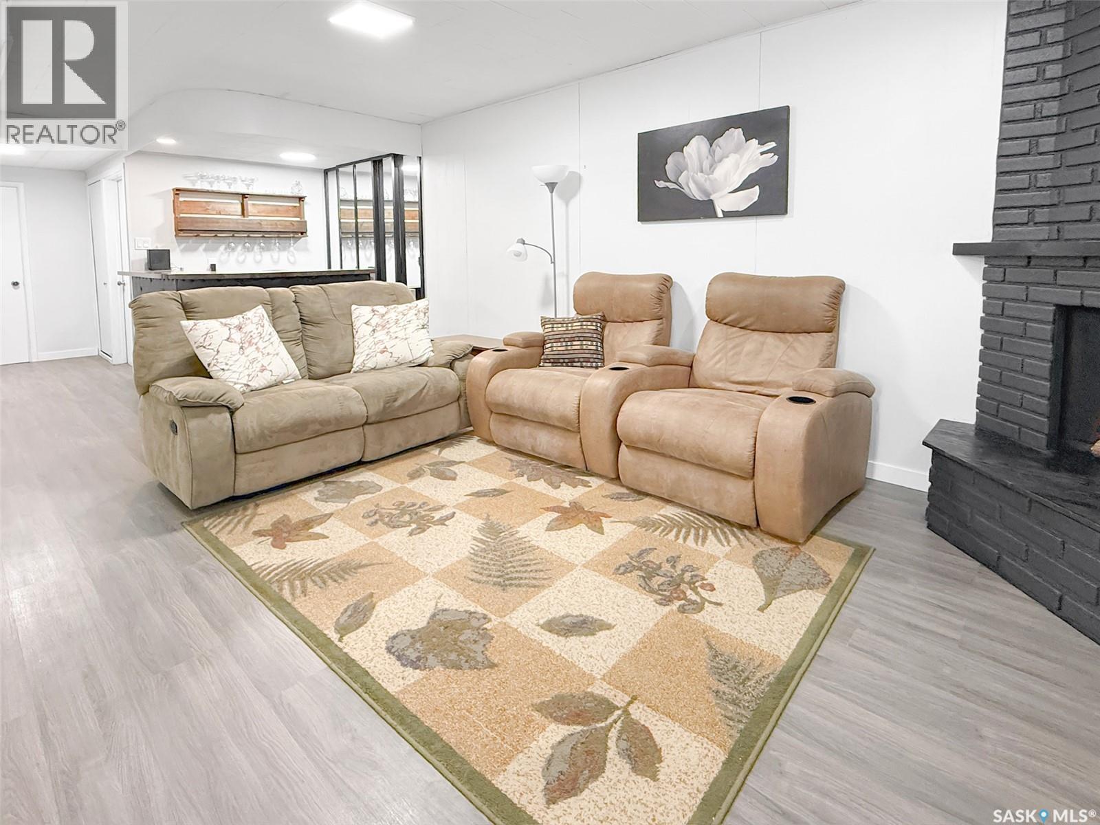 426 15Th Avenue Ne, Swift Current, SK - Indoor Photo Showing Living Room With Fireplace