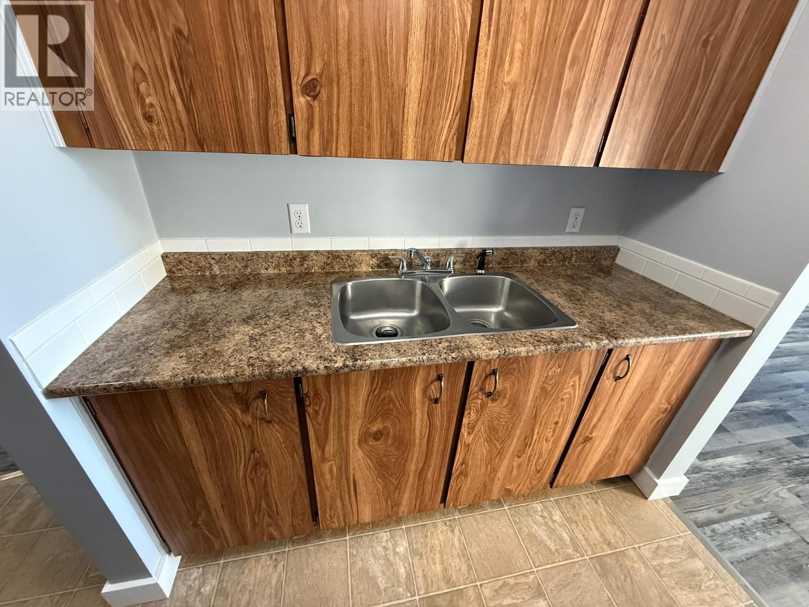 212 Spieker Avenue Unit# 205, Tumbler Ridge, BC - Indoor Photo Showing Kitchen With Double Sink