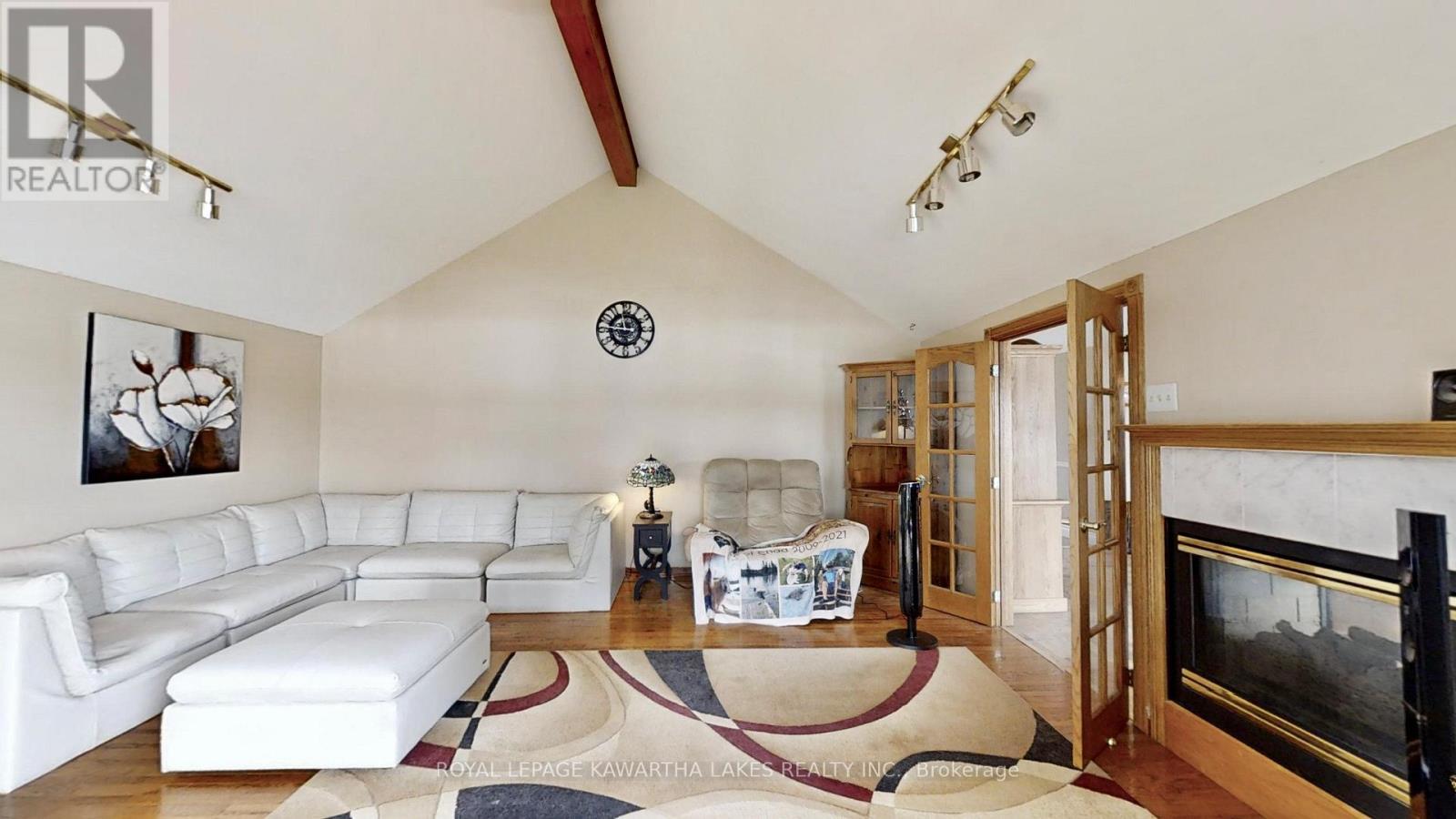 21 Trent View Road, Kawartha Lakes (Eldon), ON - Indoor Photo Showing Living Room With Fireplace