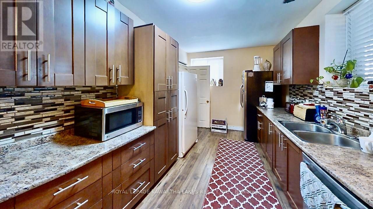 21 Trent View Road, Kawartha Lakes (Eldon), ON - Indoor Photo Showing Kitchen With Double Sink