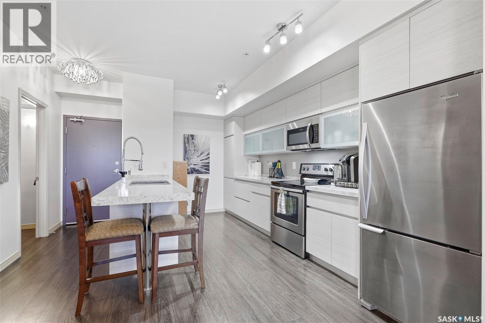 213 223 Evergreen Square, Saskatoon, SK - Indoor Photo Showing Kitchen With Stainless Steel Kitchen
