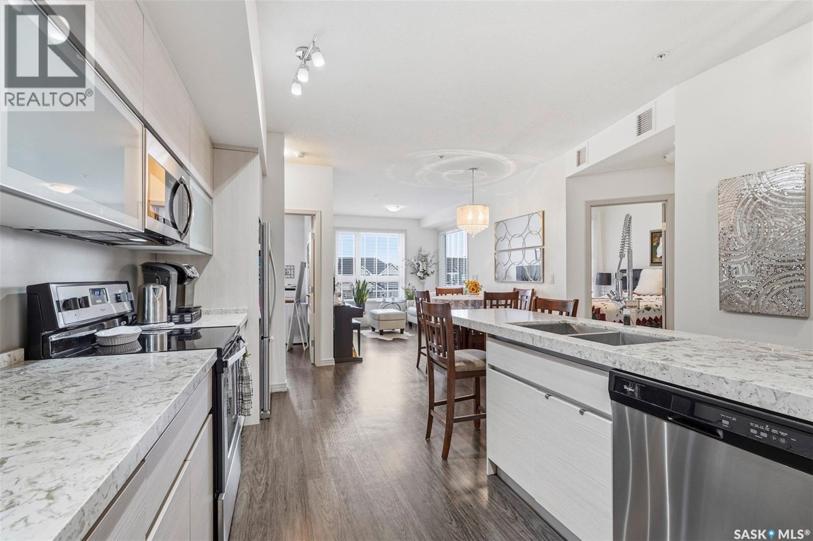 213 223 Evergreen Square, Saskatoon, SK - Indoor Photo Showing Kitchen With Double Sink With Upgraded Kitchen