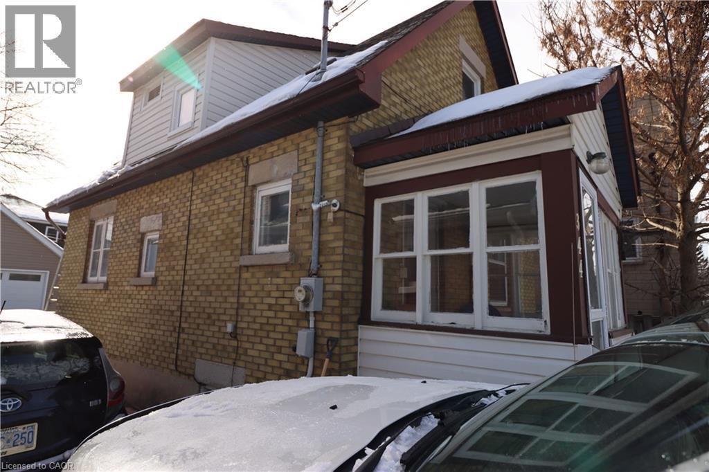 Charming Downtown Guelph Century Home with Modern Comforts & Versatile Studio Space. Welcome to this inviting 1915 brick home, ideally located in the heart of downtown Guelph. - 344 Paisley Road, Guelph, ON - Outdoor With Exterior