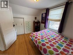 third bedroom with 4 drawer 1 pull door cabinet -