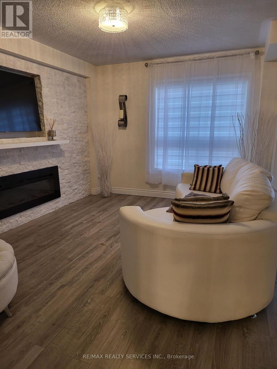 19 Albery Road, Brampton, ON - Indoor Photo Showing Living Room With Fireplace