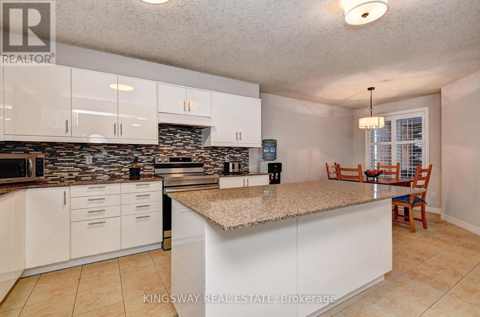 242 Doon Mills Drive, Kitchener, ON - Indoor Photo Showing Kitchen With Upgraded Kitchen