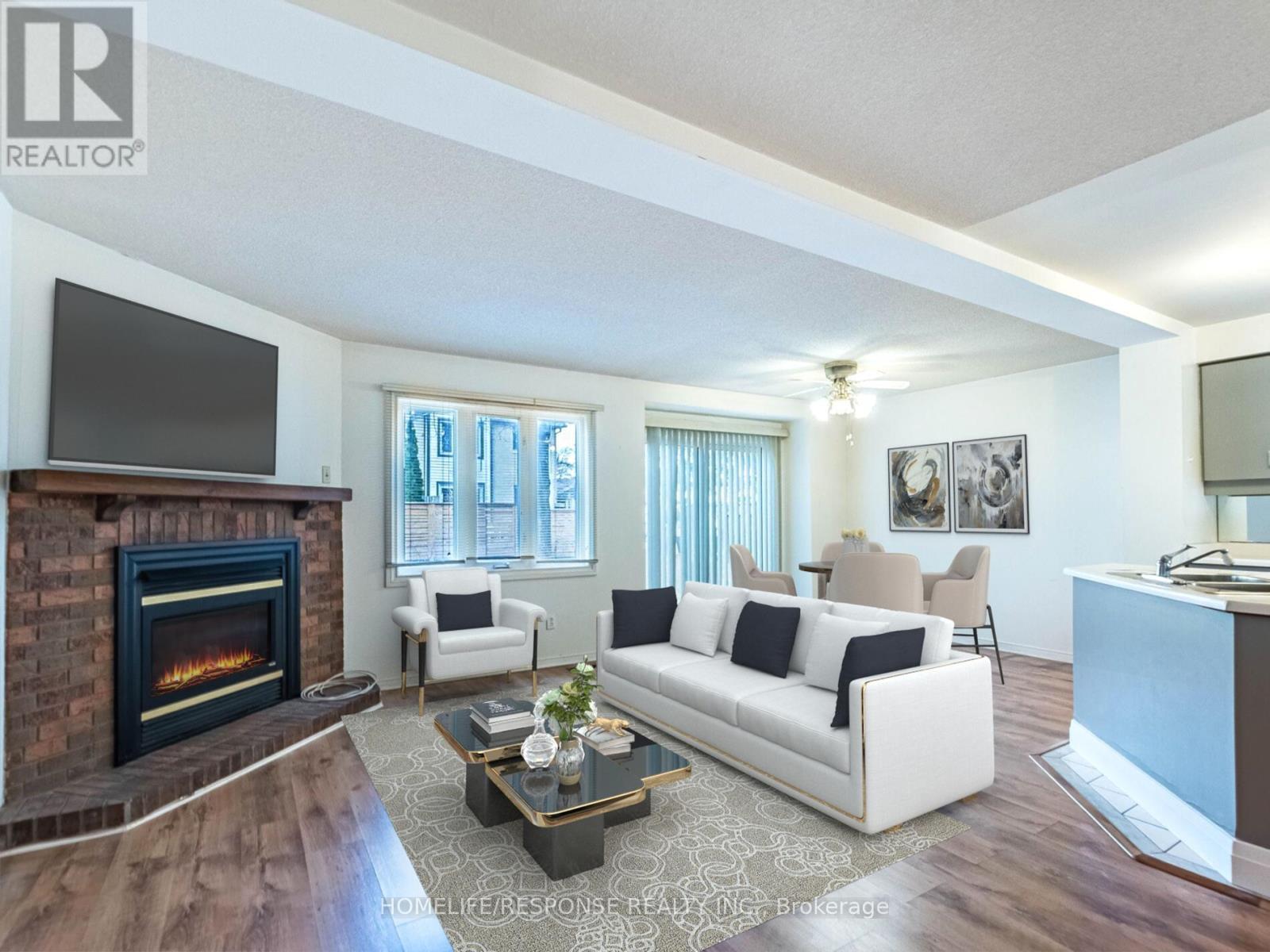 78 - 2275 Credit Valley Road, Mississauga, ON - Indoor Photo Showing Living Room With Fireplace