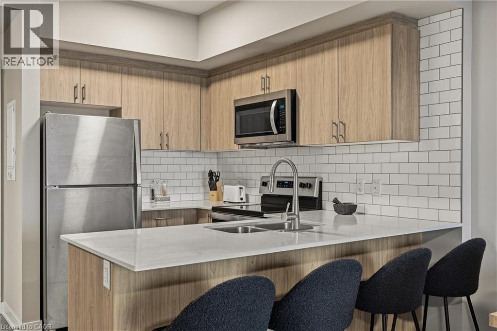 16 Markle Crescent Unit# 413, Hamilton, ON - Indoor Photo Showing Kitchen With Double Sink