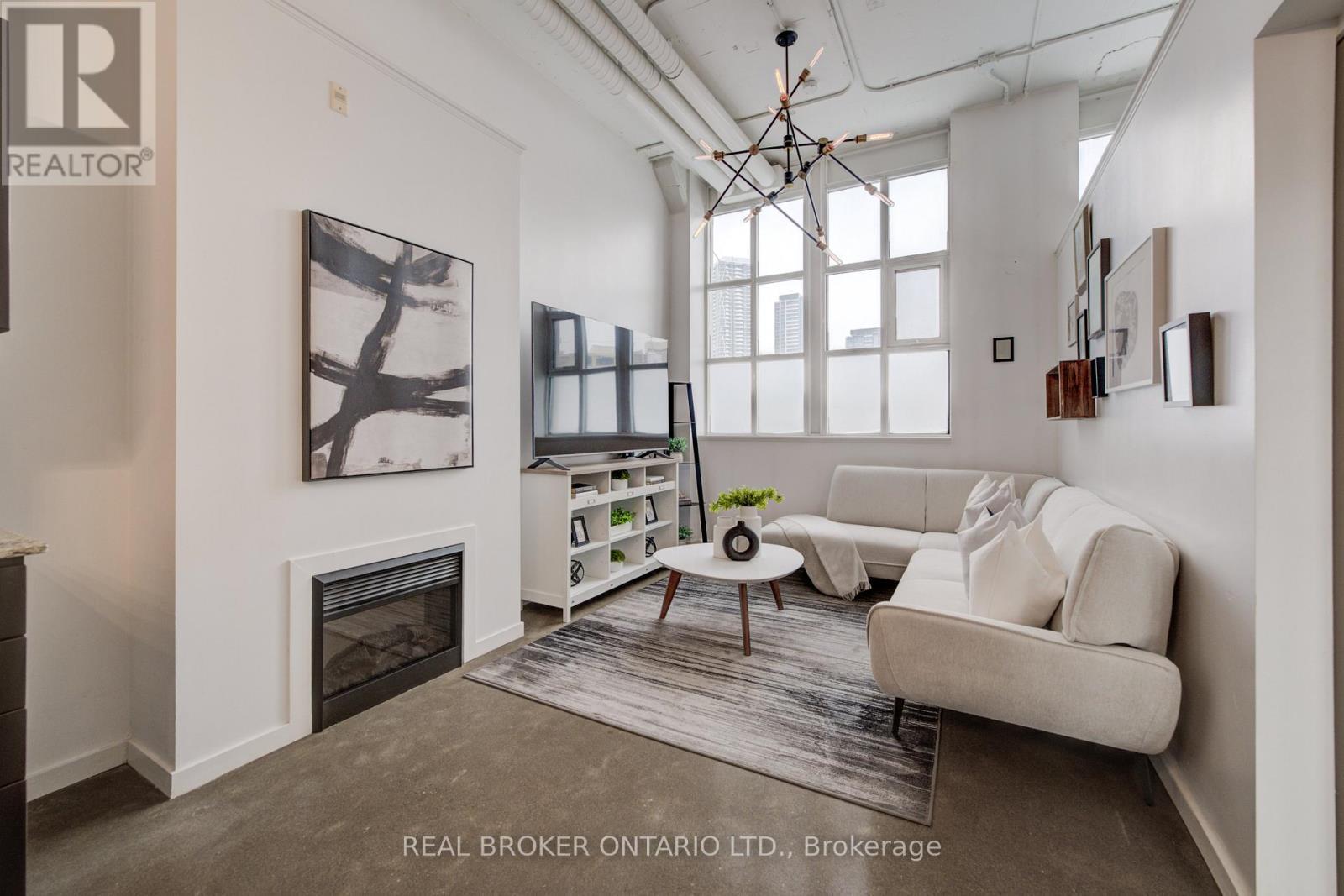 126 - 410 King Street W, Kitchener, ON - Indoor Photo Showing Living Room With Fireplace
