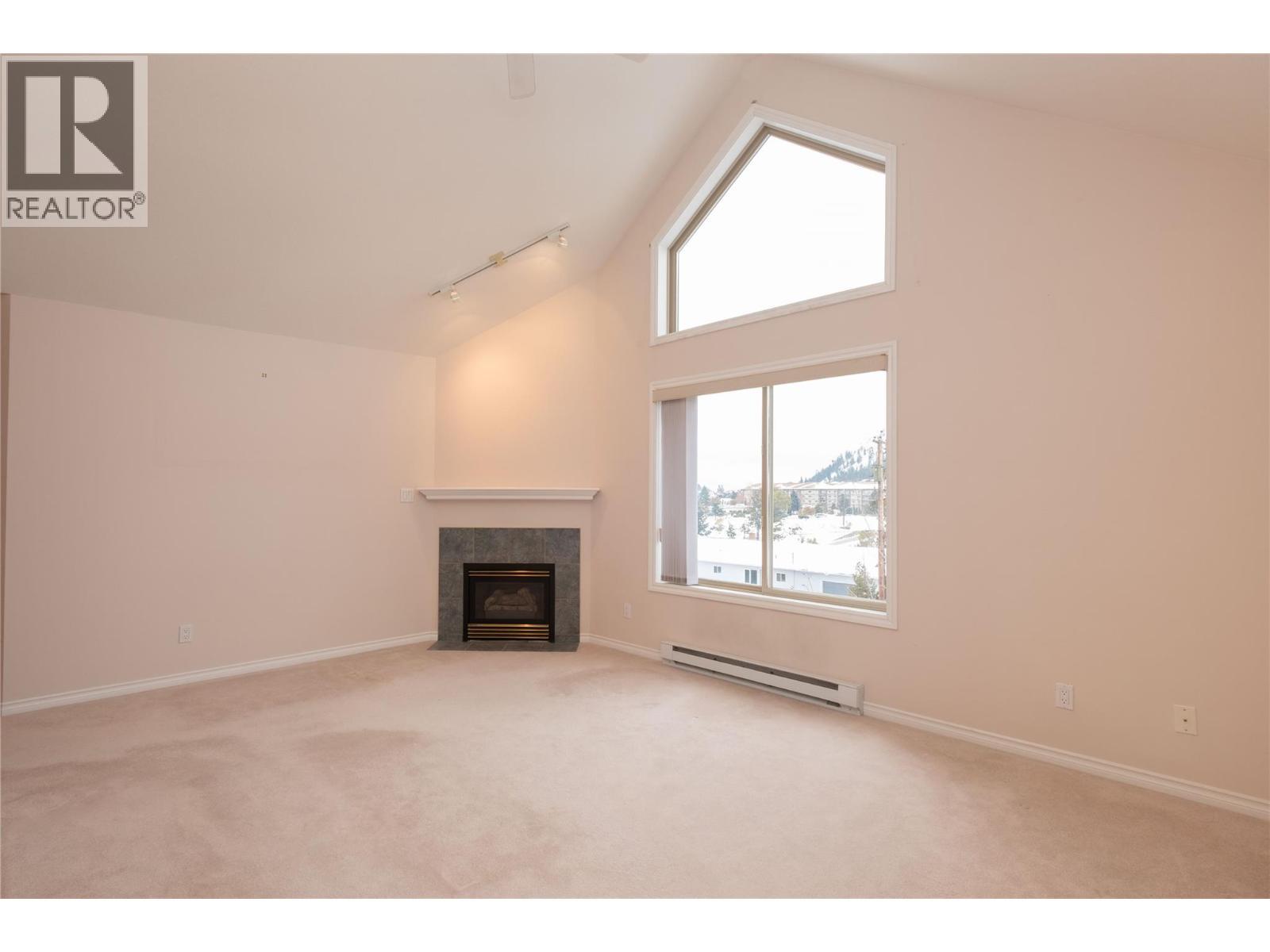 8416 Jubilee Road Unit# 306, Summerland, BC - Indoor With Fireplace