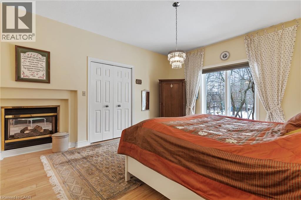 5114 Meadowood Lane, Beamsville, ON - Indoor Photo Showing Bedroom With Fireplace
