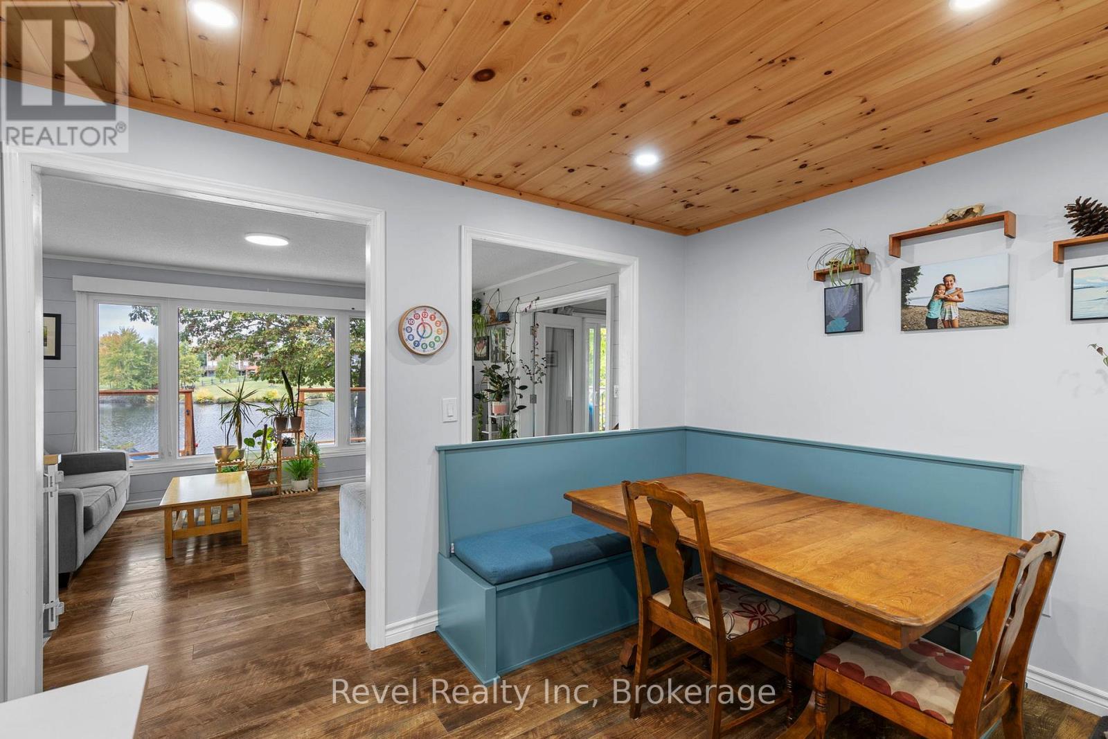 Dining looking into living room and over lake - 210 Burnett'S Road, Mckellar, ON - Indoor Photo Showing Dining Room