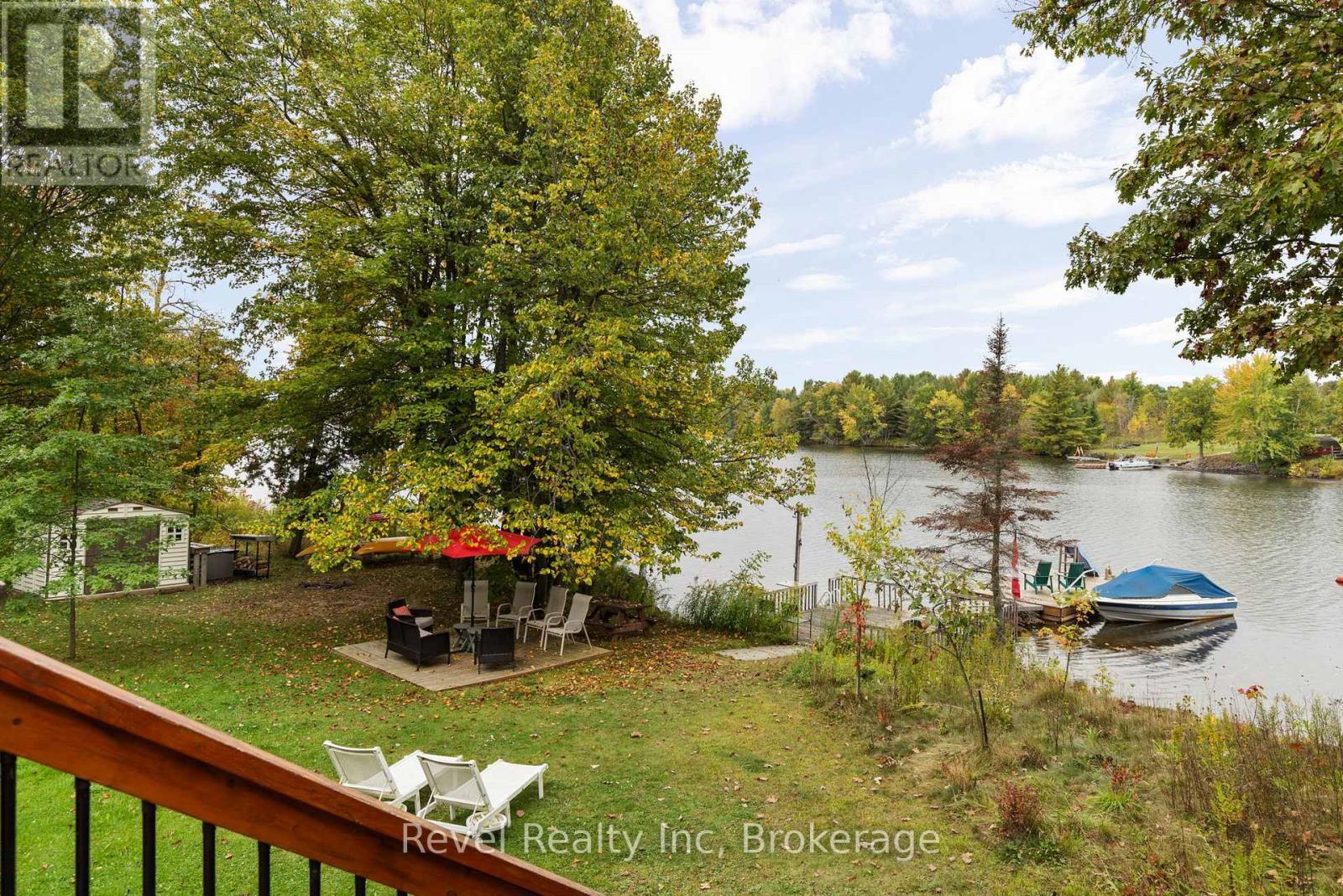 Main Floor Deck over looking lake - 210 Burnett'S Road, Mckellar, ON - Outdoor With Body Of Water