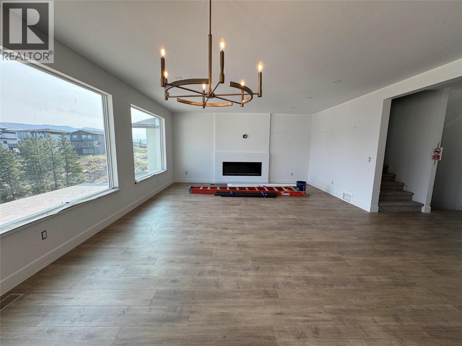Dining/Living - 2170 Galore Crescent, Kamloops, BC - Indoor With Fireplace