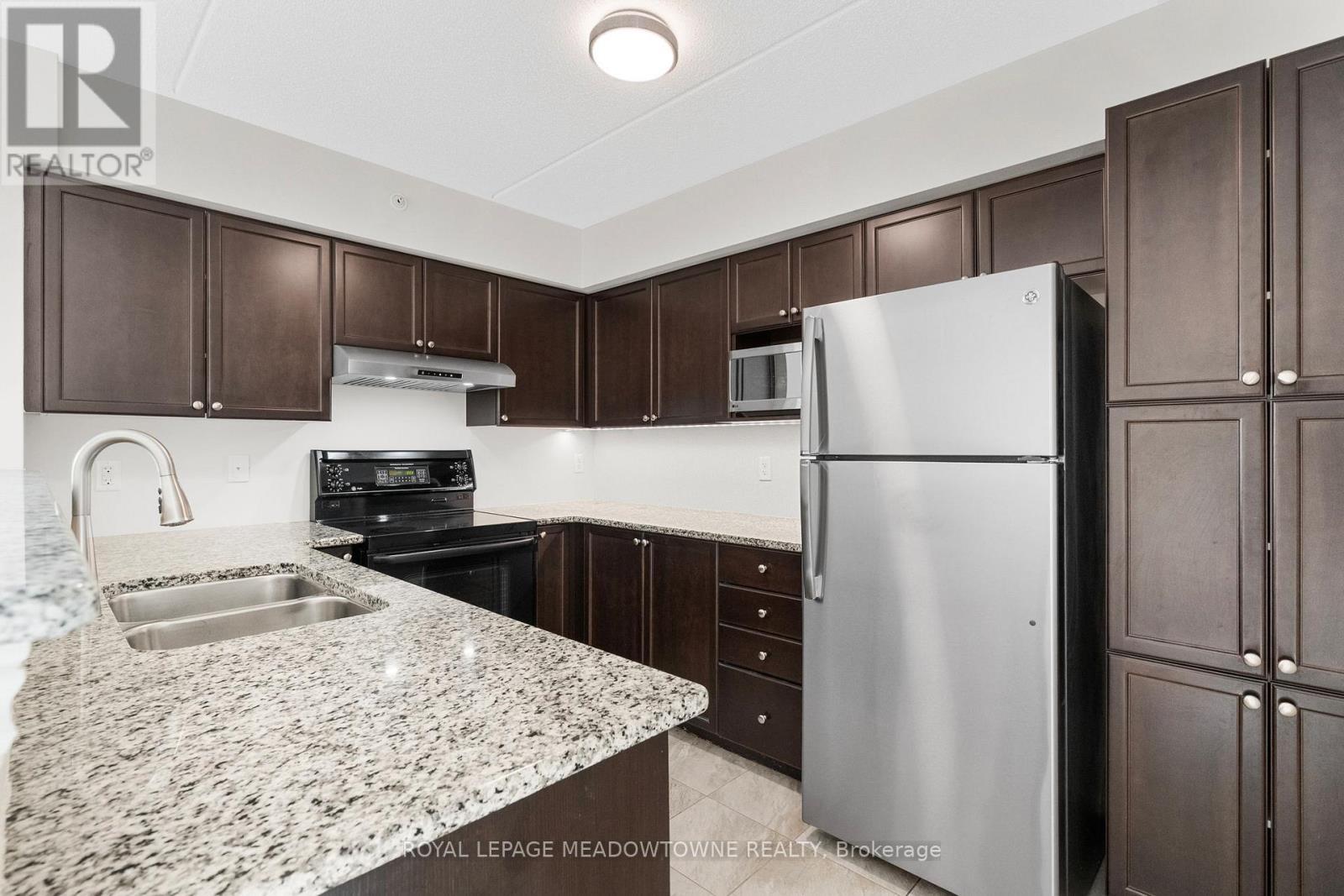 310 - 1470 Main Street E, Milton, ON - Indoor Photo Showing Kitchen With Stainless Steel Kitchen With Double Sink