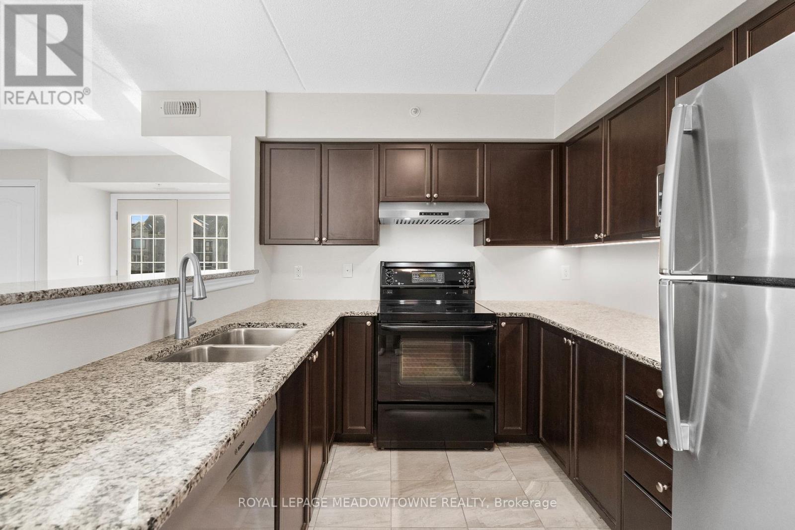 310 - 1470 Main Street E, Milton, ON - Indoor Photo Showing Kitchen With Double Sink
