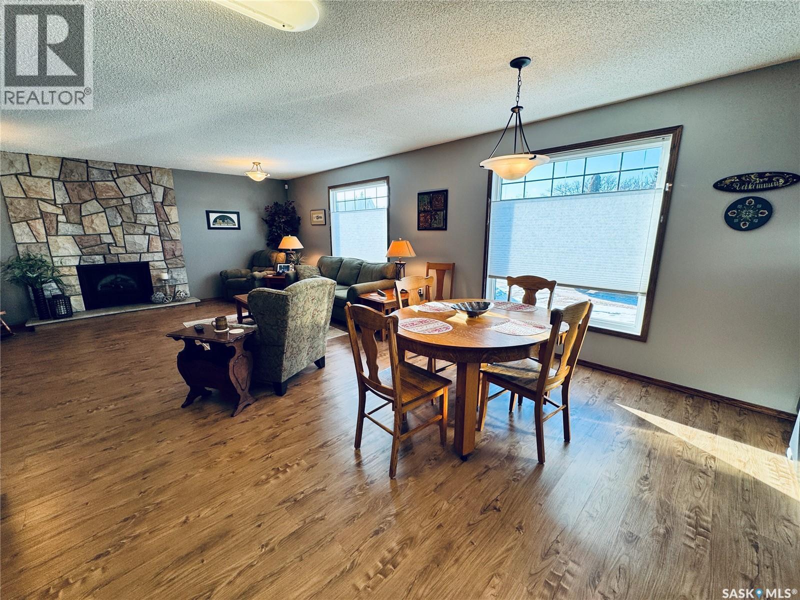 403 8Th Avenue W, Biggar, SK - Indoor Photo Showing Dining Room With Fireplace