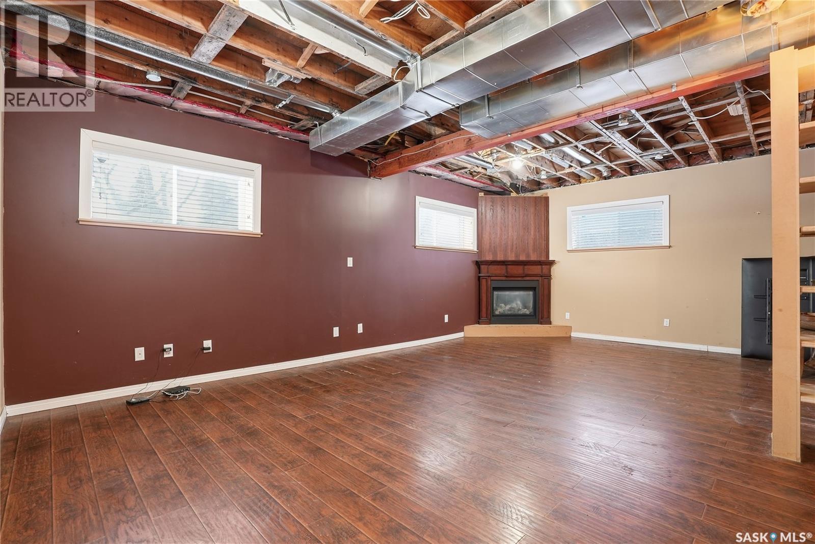 5 4Th Avenue N, Martensville, SK - Indoor Photo Showing Basement With Fireplace
