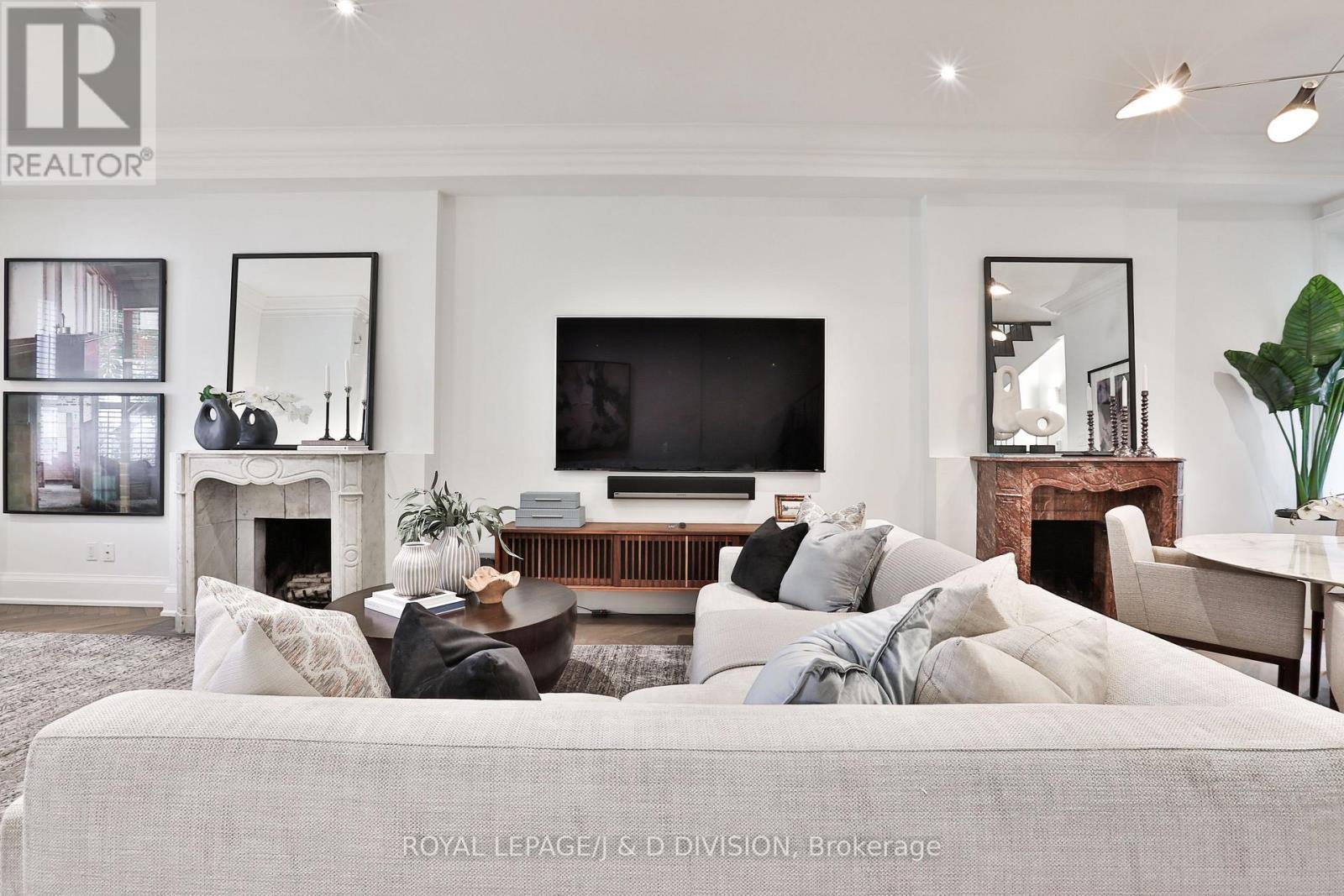 Six Sonos entertainment systems - 69 Sullivan Street, Toronto, ON - Indoor Photo Showing Living Room With Fireplace