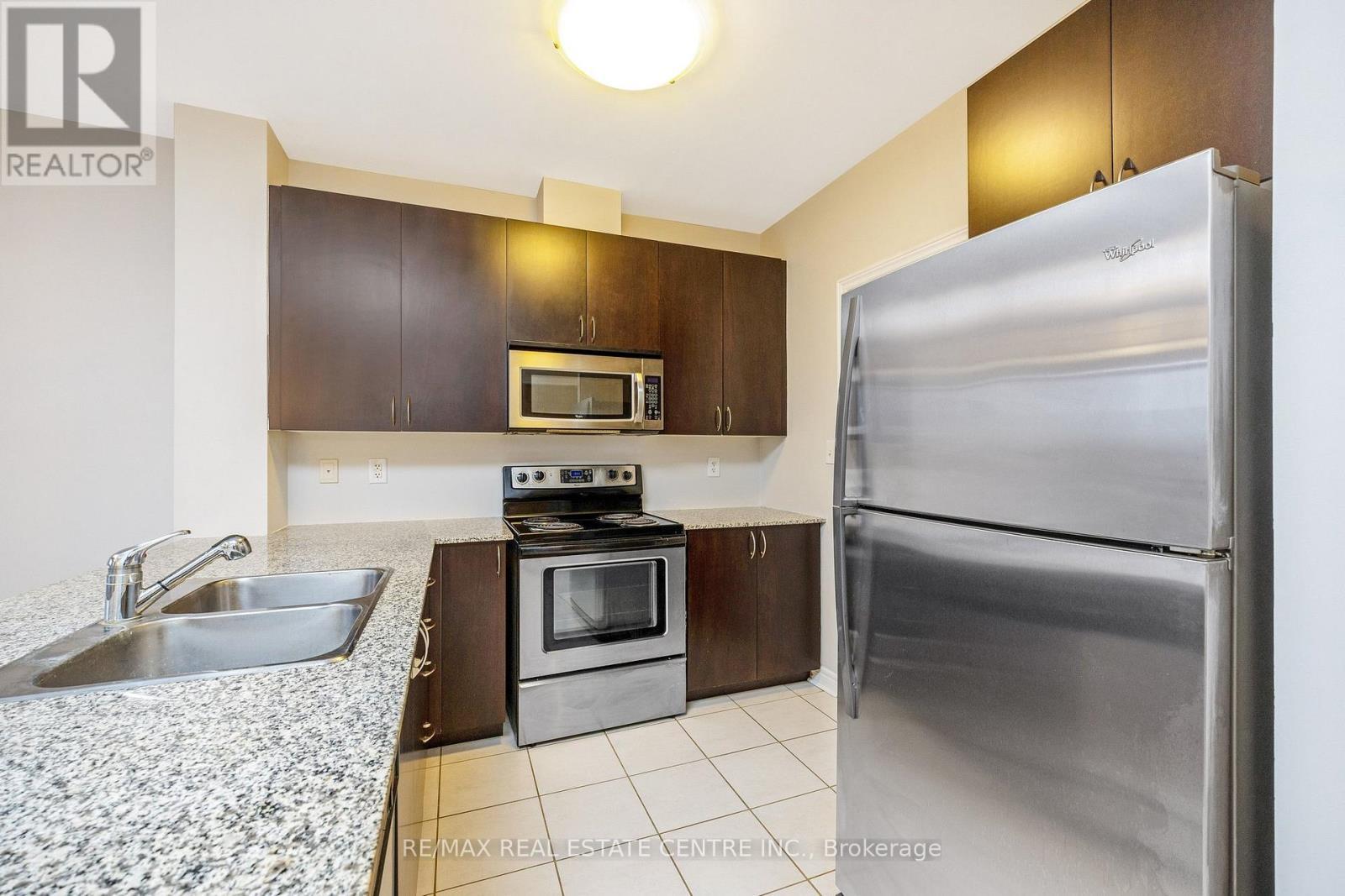 216 - 383 Main Street E, Milton, ON - Indoor Photo Showing Kitchen With Double Sink