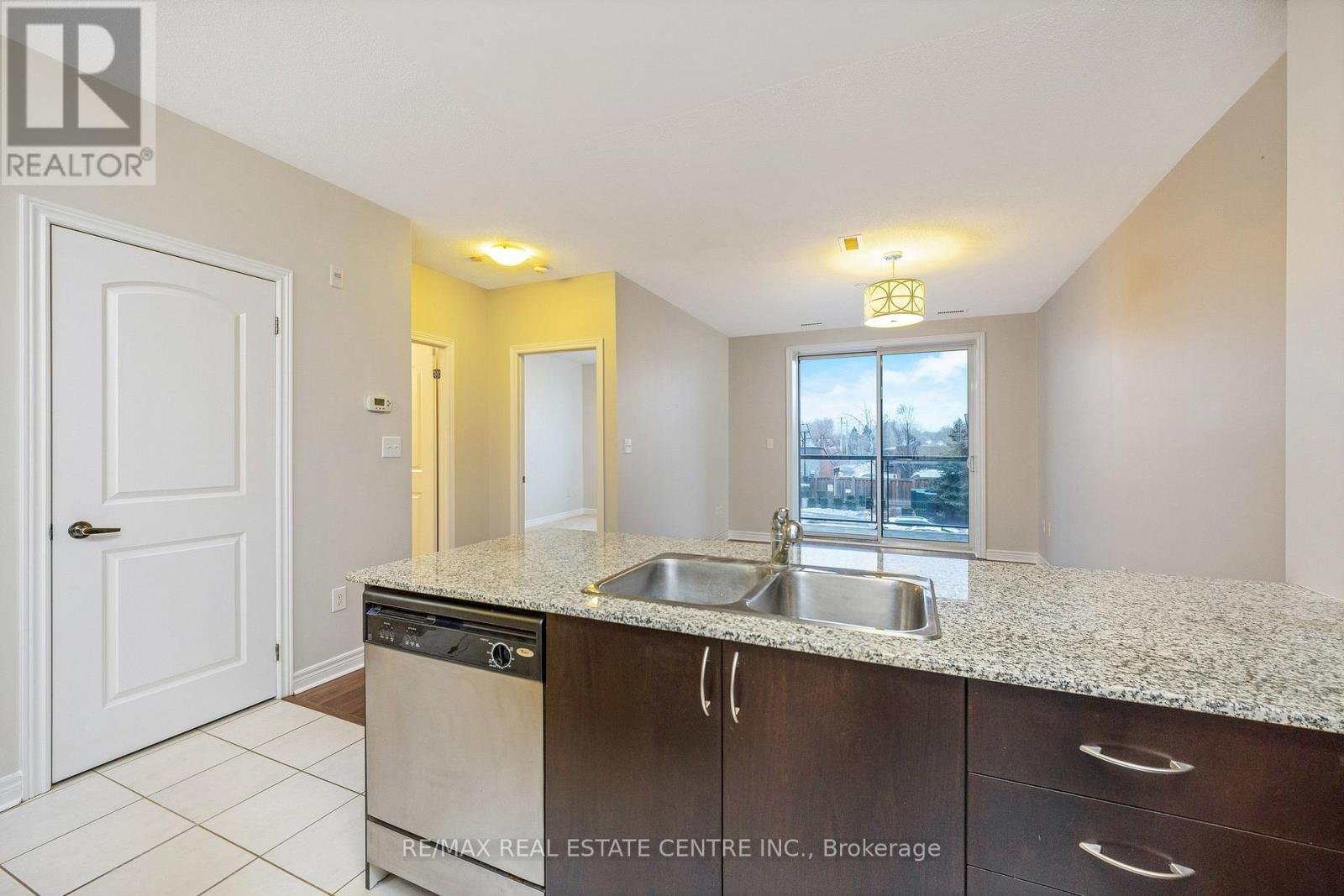 216 - 383 Main Street E, Milton, ON - Indoor Photo Showing Kitchen With Double Sink