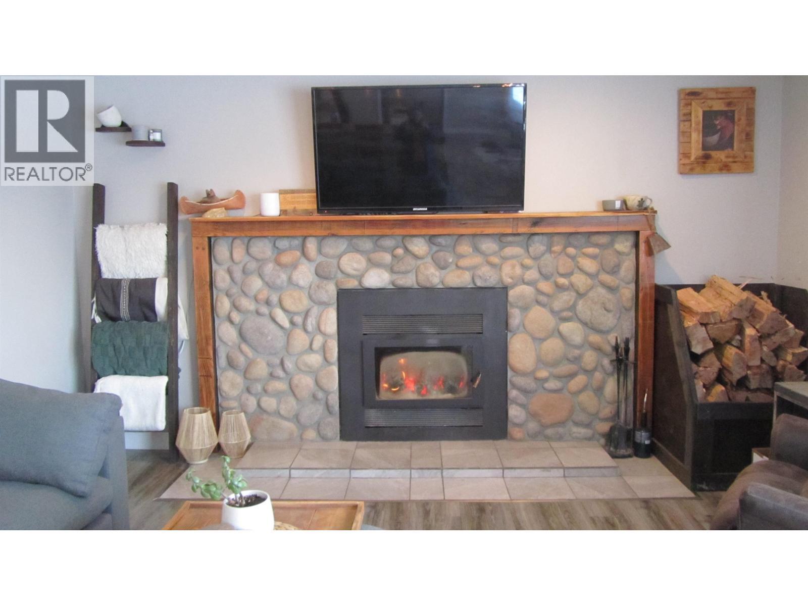 6313 Archie Meadow Road, Forest Grove, BC - Indoor Photo Showing Living Room With Fireplace