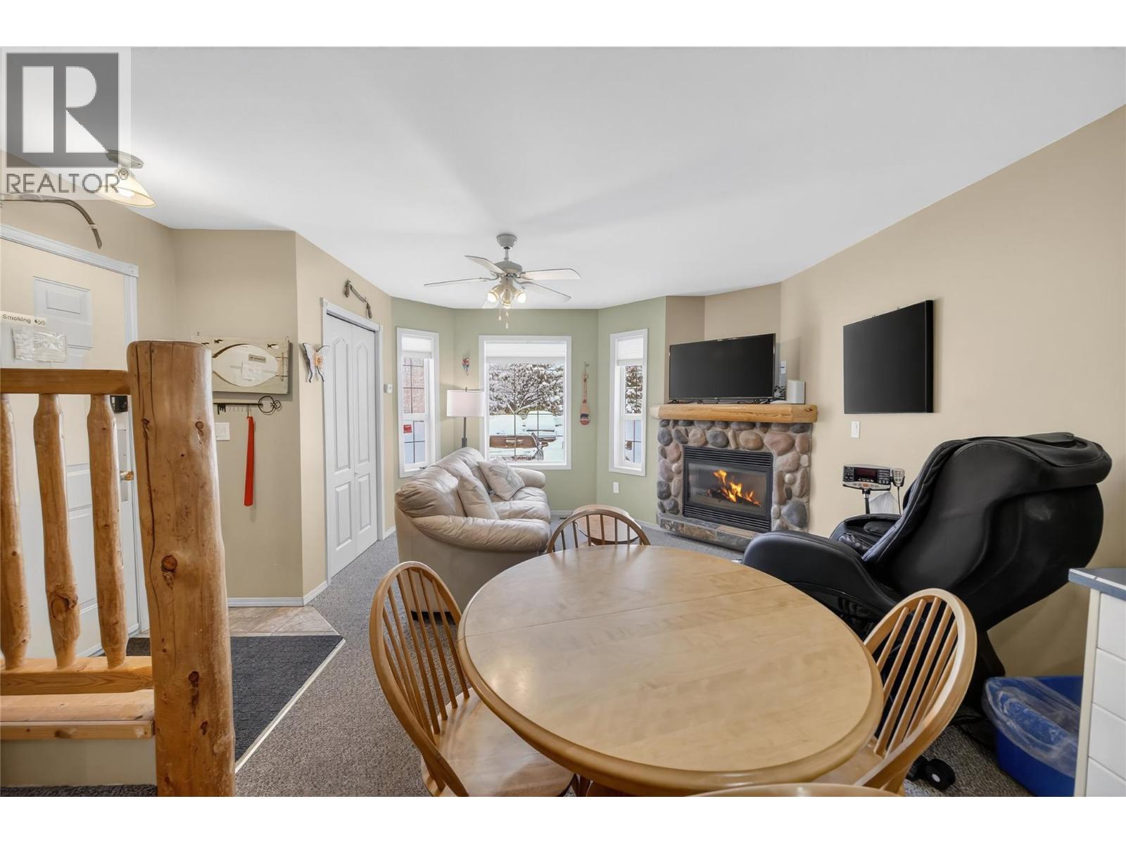 400 Riverside Way Unit# 438, Fernie, BC - Indoor Photo Showing Dining Room With Fireplace