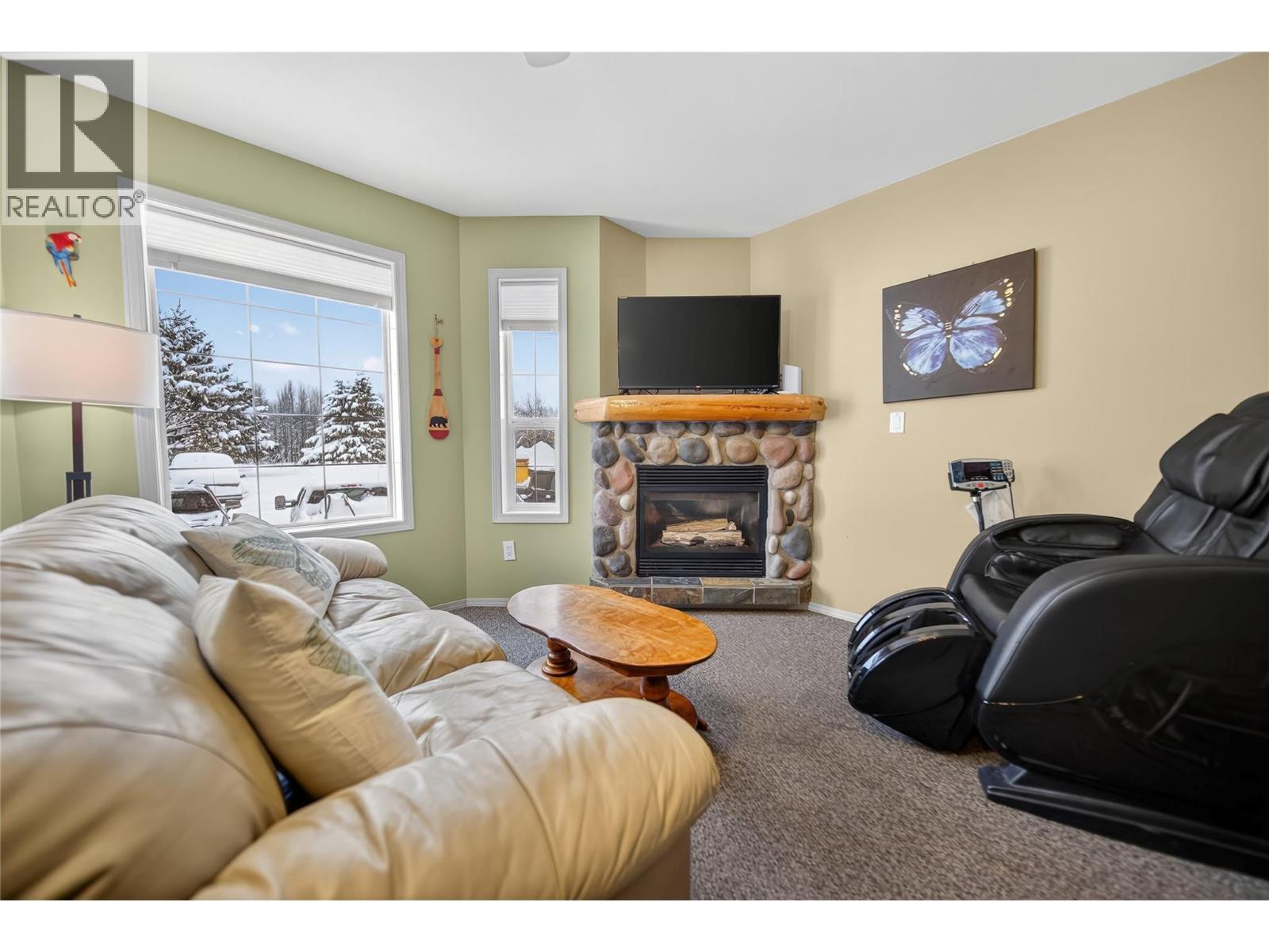 400 Riverside Way Unit# 438, Fernie, BC - Indoor Photo Showing Living Room With Fireplace