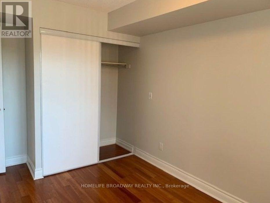 Bedroom Closet With Sliding Door - 315 - 2 Clairtrell Road, Toronto, ON - Indoor Photo Showing Other Room