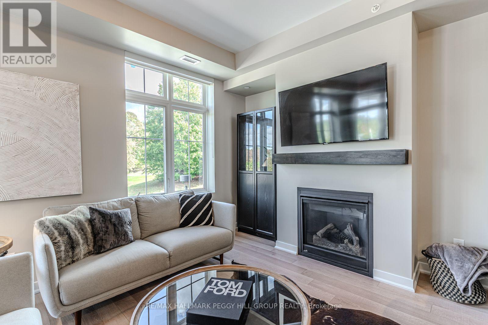 217 - 40 Horseshoe Boulevard, Oro-Medonte, ON - Indoor Photo Showing Living Room With Fireplace