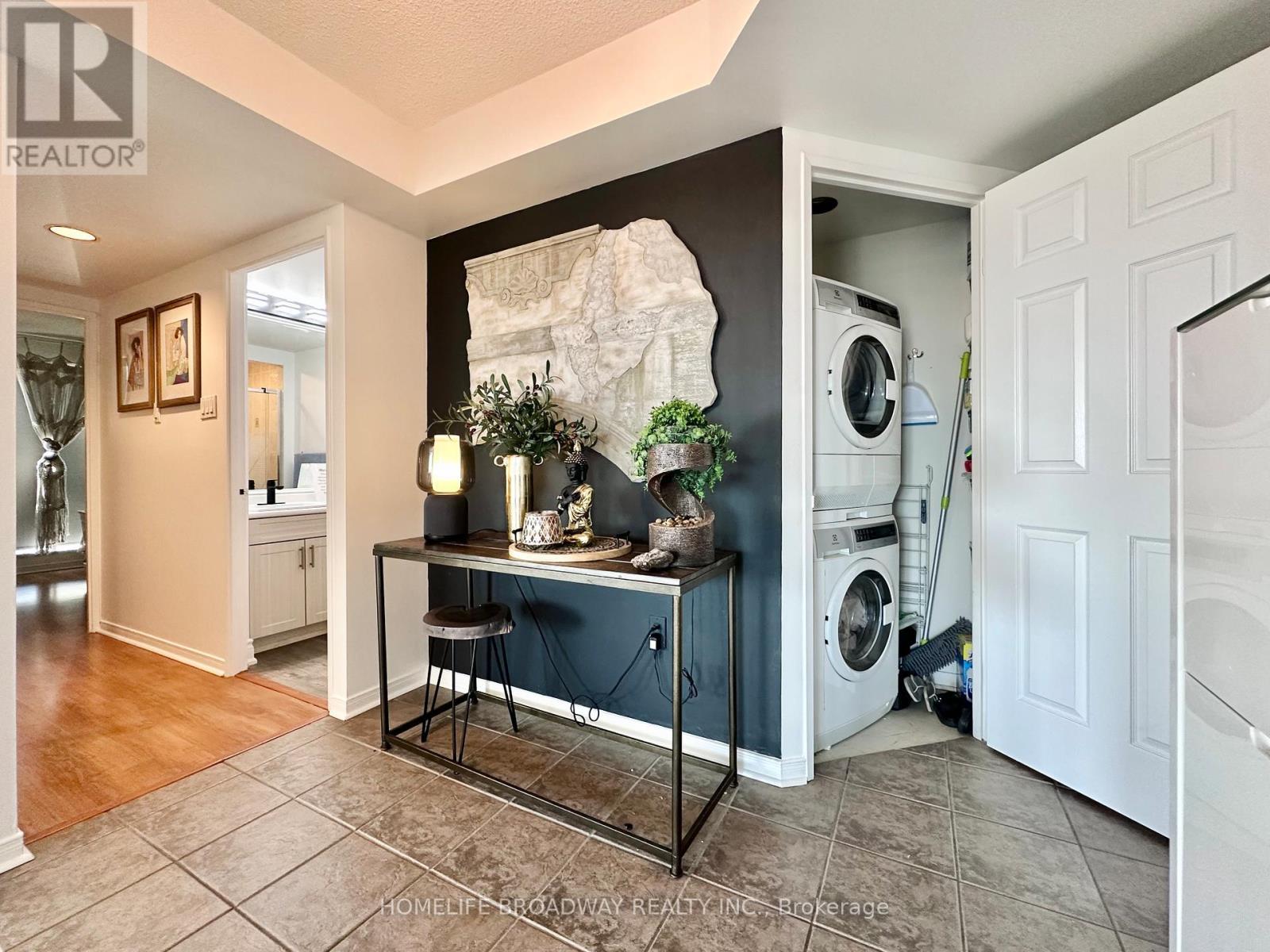 Spacious Peaceful Corridor with Laundry Room - 1709 - 2155 Burnhamthorpe Road W, Mississauga, ON - Indoor Photo Showing Laundry Room