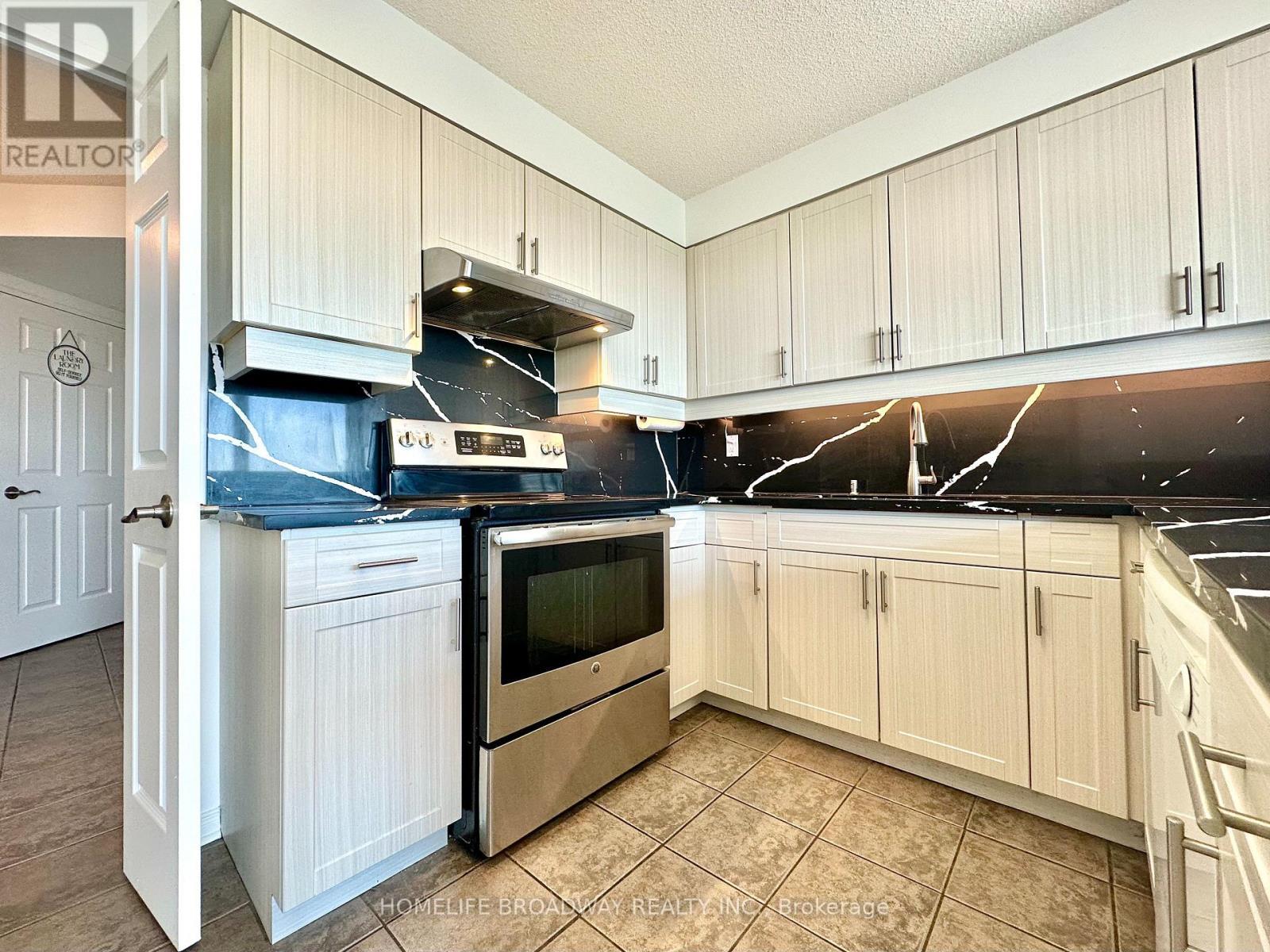 Custom Kitchen Countertops - 1709 - 2155 Burnhamthorpe Road W, Mississauga, ON - Indoor Photo Showing Kitchen With Double Sink
