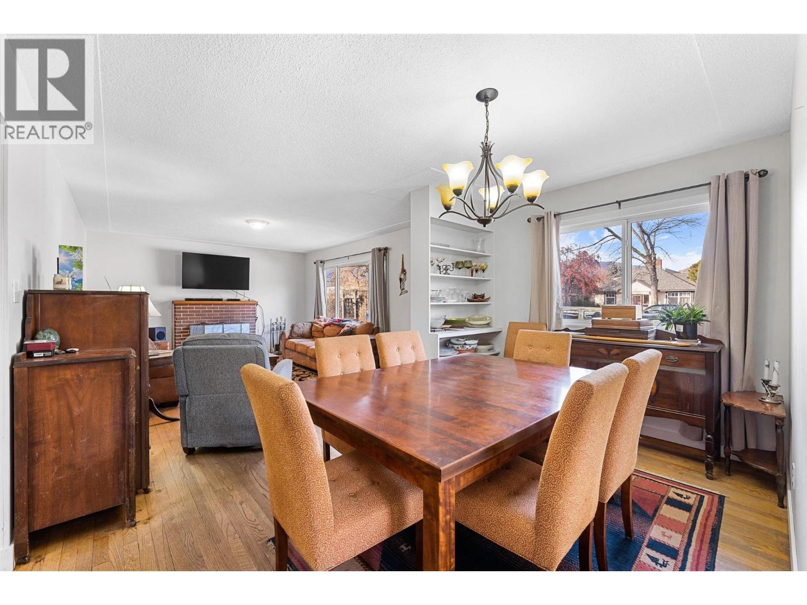 545 Bay Avenue, Kelowna, BC - Indoor Photo Showing Dining Room With Fireplace