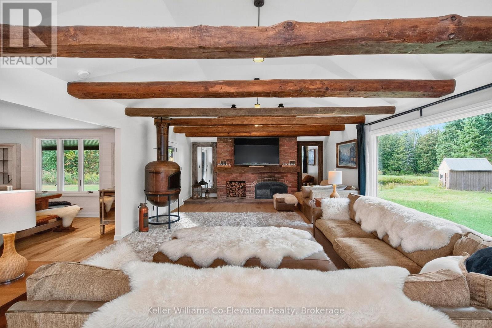 1076 Beaver Lane, Springwater, ON - Indoor Photo Showing Living Room With Fireplace