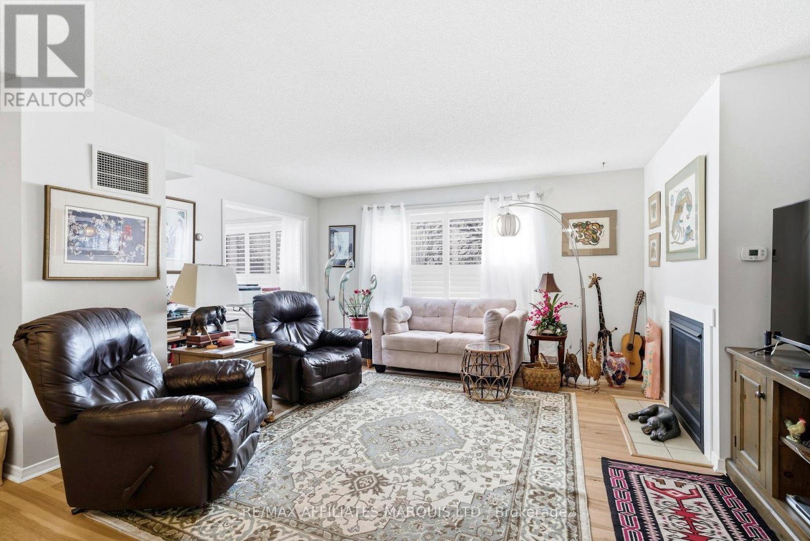 212 - 121 Water Street W, Cornwall, ON - Indoor Photo Showing Living Room With Fireplace