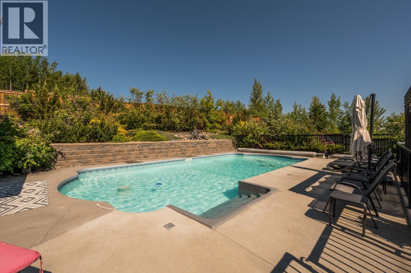 7603 Grayshell Road, Prince George, BC - Outdoor With In Ground Pool With Deck Patio Veranda With Backyard