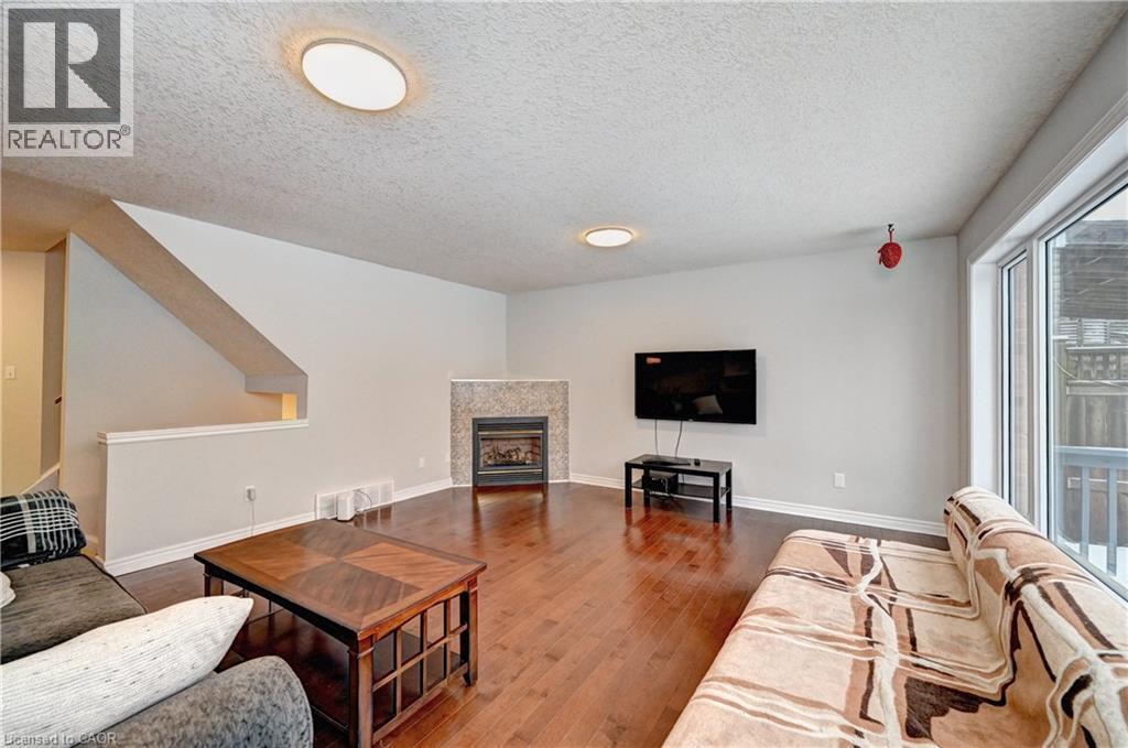 242 Doon Mills Drive, Kitchener, ON - Indoor Photo Showing Living Room With Fireplace