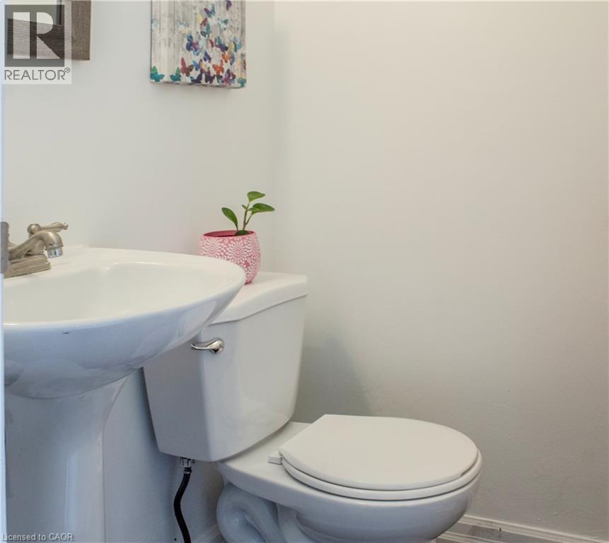 Half bath featuring baseboards and toilet - 48 Riverdale Drive Unit# 2, Hamilton, ON - Indoor Photo Showing Bathroom