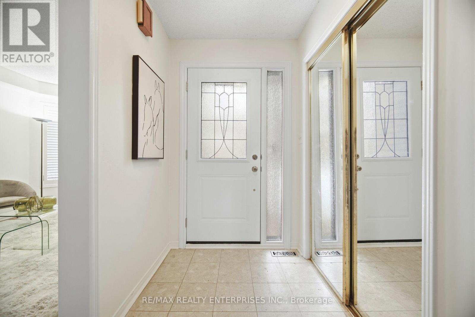 Bright foyer features large closet and bench area - 1104 Feeley Court, Mississauga, ON - Indoor Photo Showing Other Room