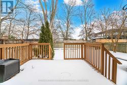 Fully fenced backyard with deck -
