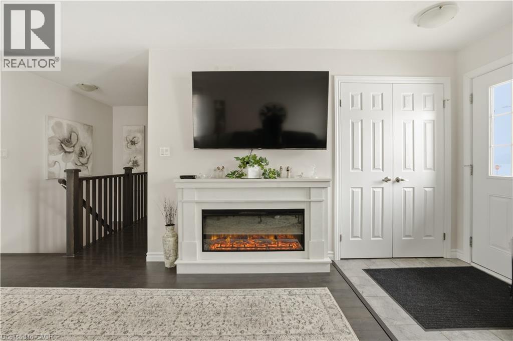 15 Irving Drive, Norwich, ON - Indoor Photo Showing Other Room With Fireplace
