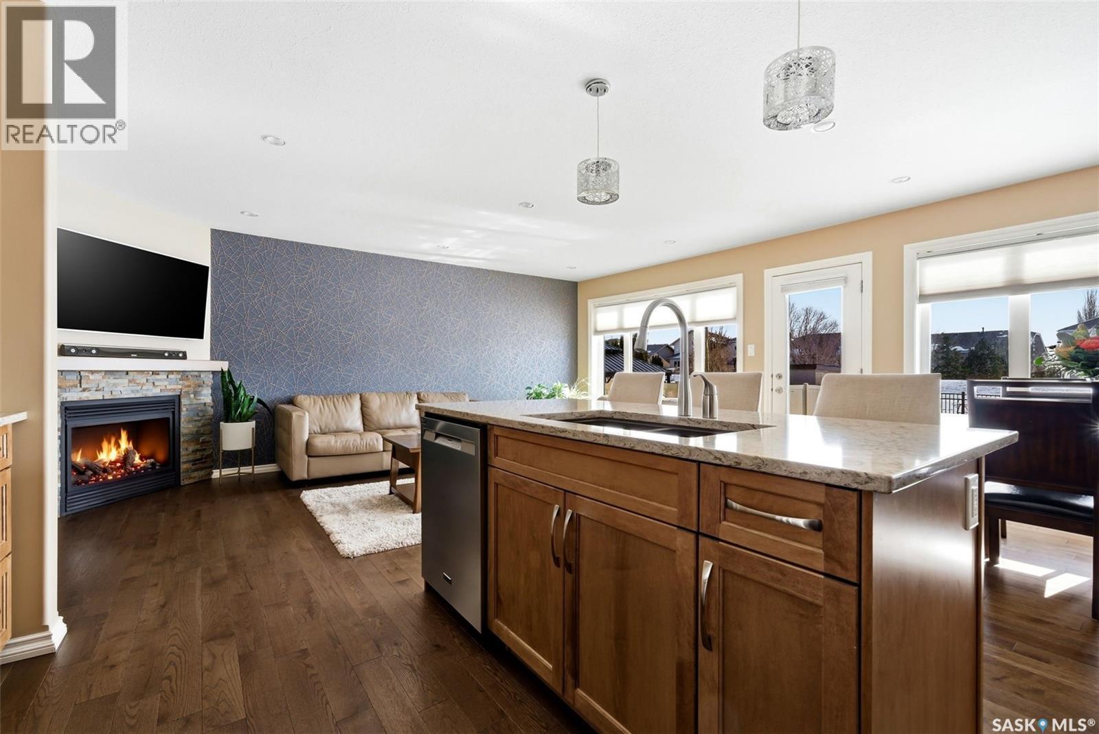 5221 Watson Way, Regina, SK - Indoor Photo Showing Kitchen With Fireplace