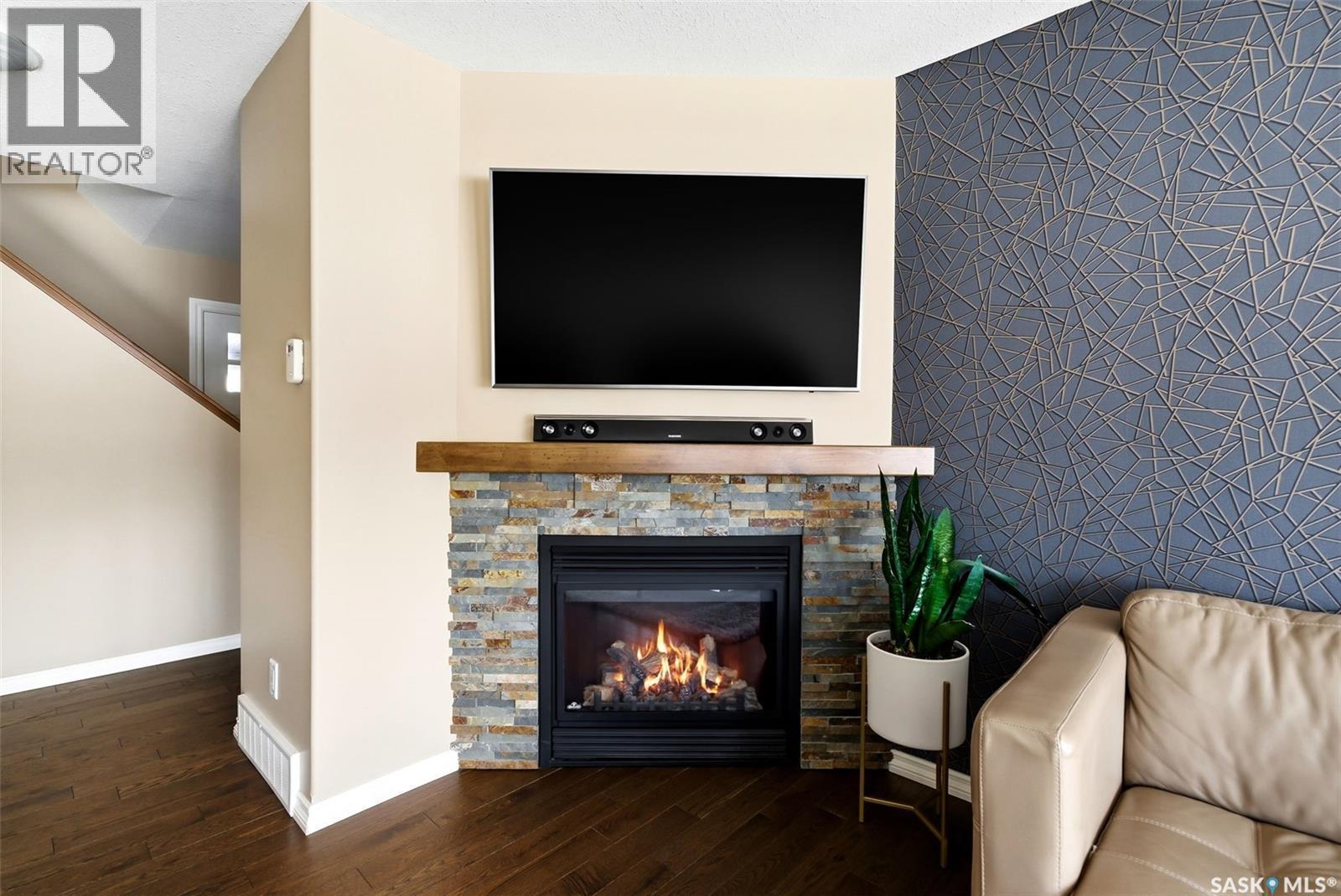 5221 Watson Way, Regina, SK - Indoor Photo Showing Living Room With Fireplace