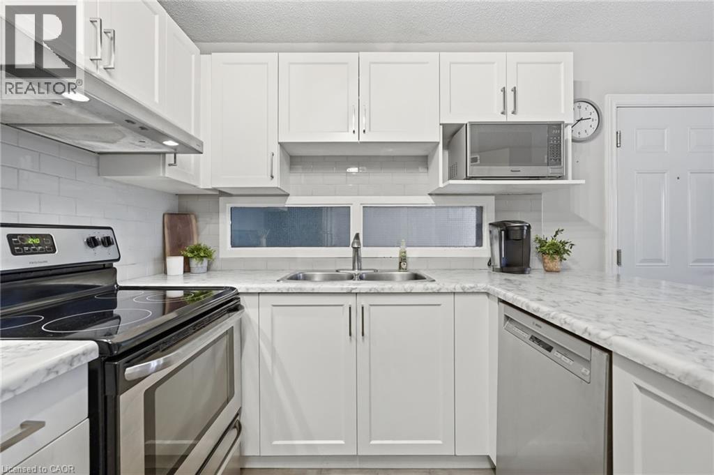 2040 Cleaver Avenue Unit# 315, Burlington, ON - Indoor Photo Showing Kitchen With Double Sink