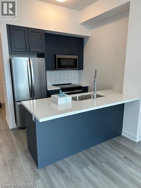 460 Dundas Street Unit# 1212, Waterdown, ON - Indoor Photo Showing Kitchen With Stainless Steel Kitchen With Double Sink With Upgraded Kitchen