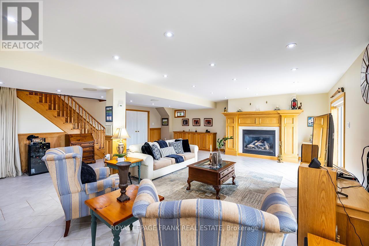 202 Southcrest Drive, Kawartha Lakes (Mariposa), ON - Indoor Photo Showing Living Room With Fireplace