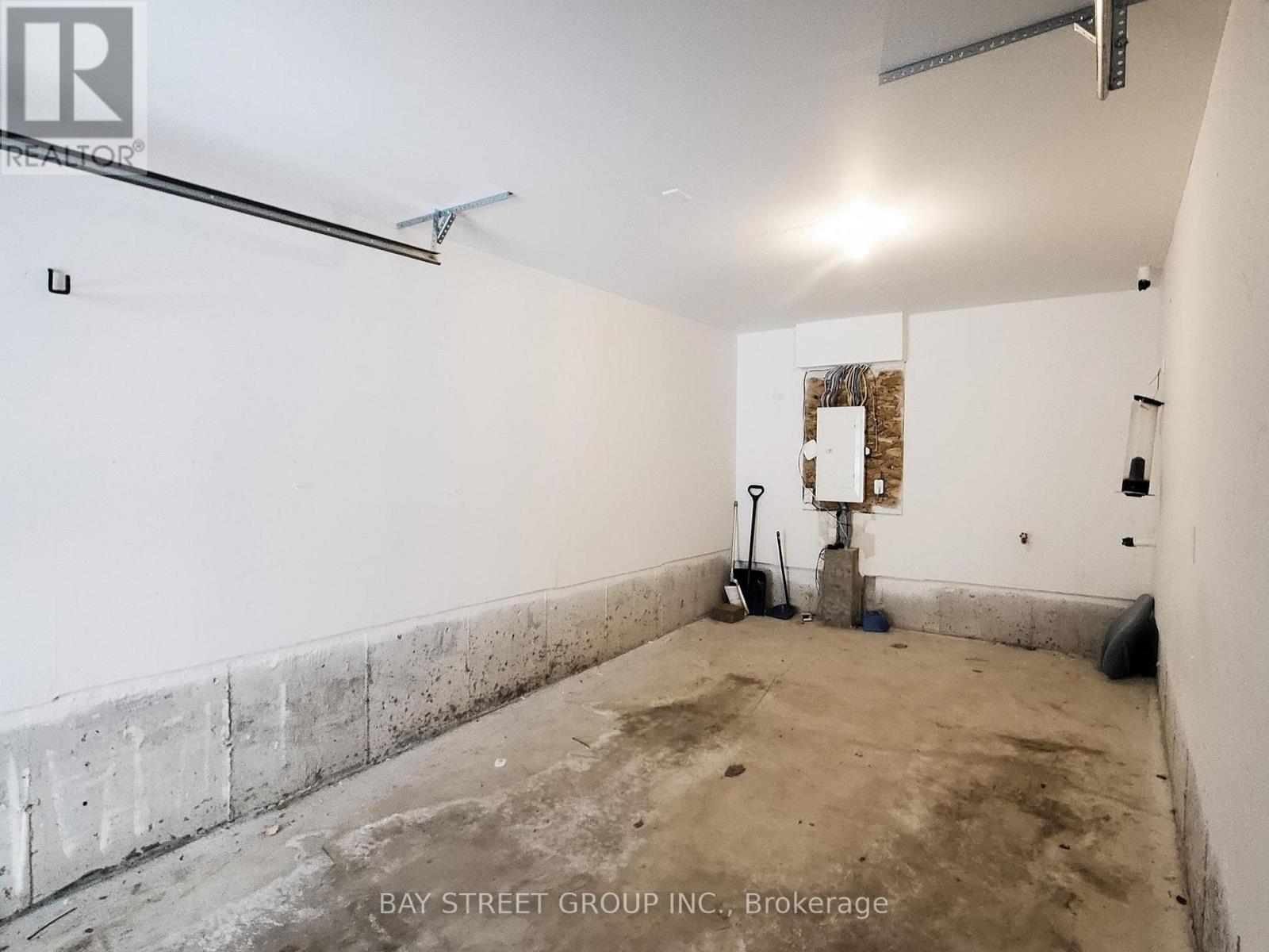 64 Emmas Way, Whitby, ON - Indoor Photo Showing Garage